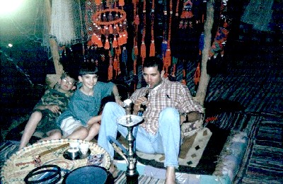Smoking a water pipe in a bedouin tent, Sinai