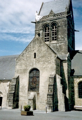 Ste. Mere Eglise, France (note the paratrooper hanging from the roof)