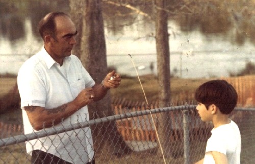 Elmer Geiges helping me with my rod and reel; Mr. Geiges fought on Iwo Jima